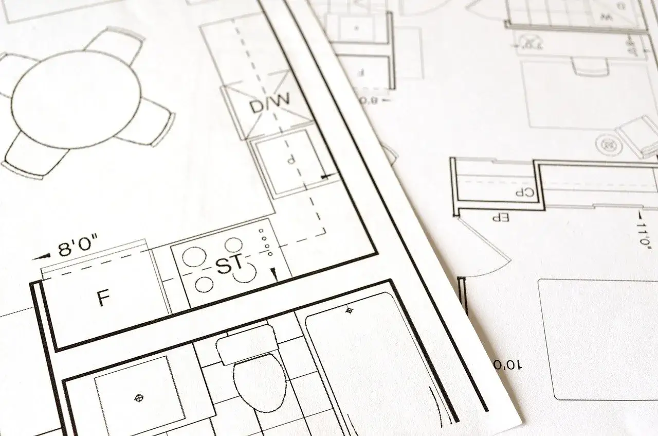 Plany architektoniczne pokazujące podział domu jednorodzinnego na 2 mieszkania. Widoczne kuchnia, łazienka i salon.